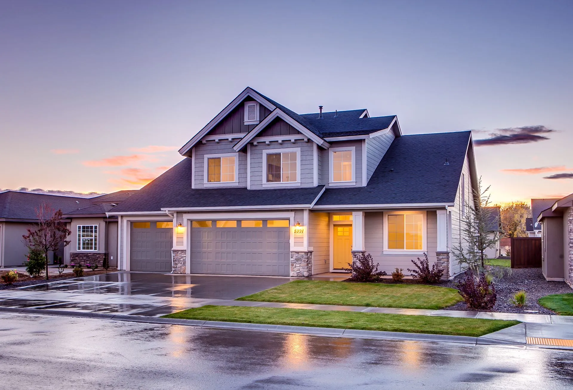 Home exterior with garage at dusk